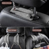 Demonstration of a durable suede car seat back storage hook system for securing bags and items.