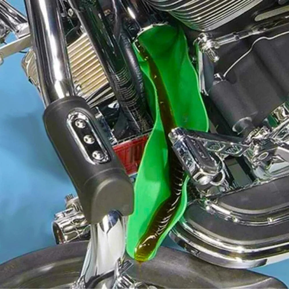 A close-up view of a flexible drain oil guide plate installed on a motorcycle engine component.