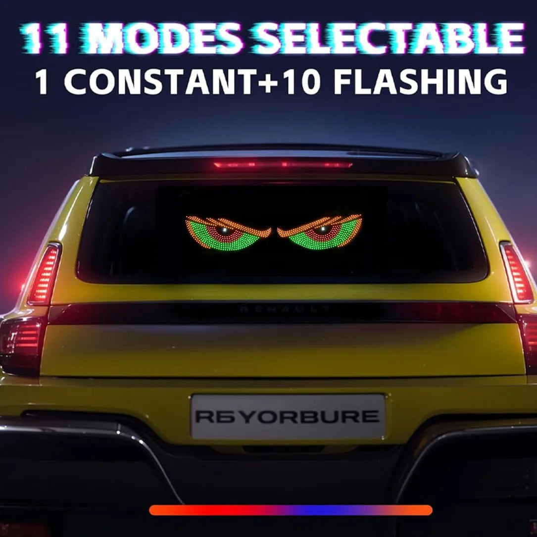 Rear view of a yellow Renault vehicle with an RGB dynamic demon eye light display visible on the trunk.