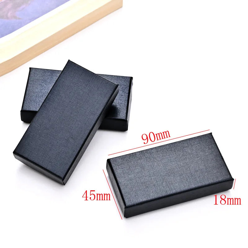 A black rectangular stainless steel initial keychain with dimensions 90mm by 45mm and a thickness of 18mm.