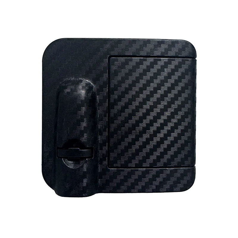 Logo de porte de voiture noire avec lumière d'accueil et surface texturée.