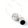 A set of crystal diamond finish tire valve caps with a textured, sparkling surface.