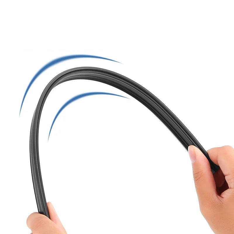 A hand is operating a black dual car side window wiper blade, demonstrating its curved movement.