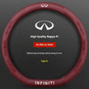 A close-up view of a red steering wheel cover for an Infiniti vehicle, featuring the Infiniti logo and text.