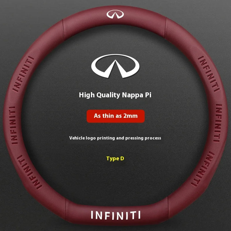 A close-up view of a red steering wheel cover for an Infiniti vehicle, featuring the Infiniti logo and text.