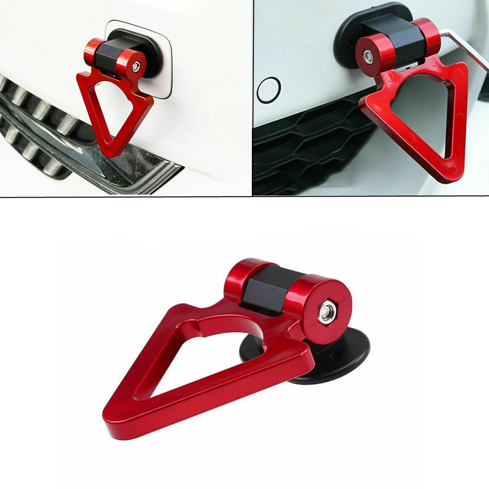 A close-up view of a red racing style car tow hook with a black mounting mechanism.