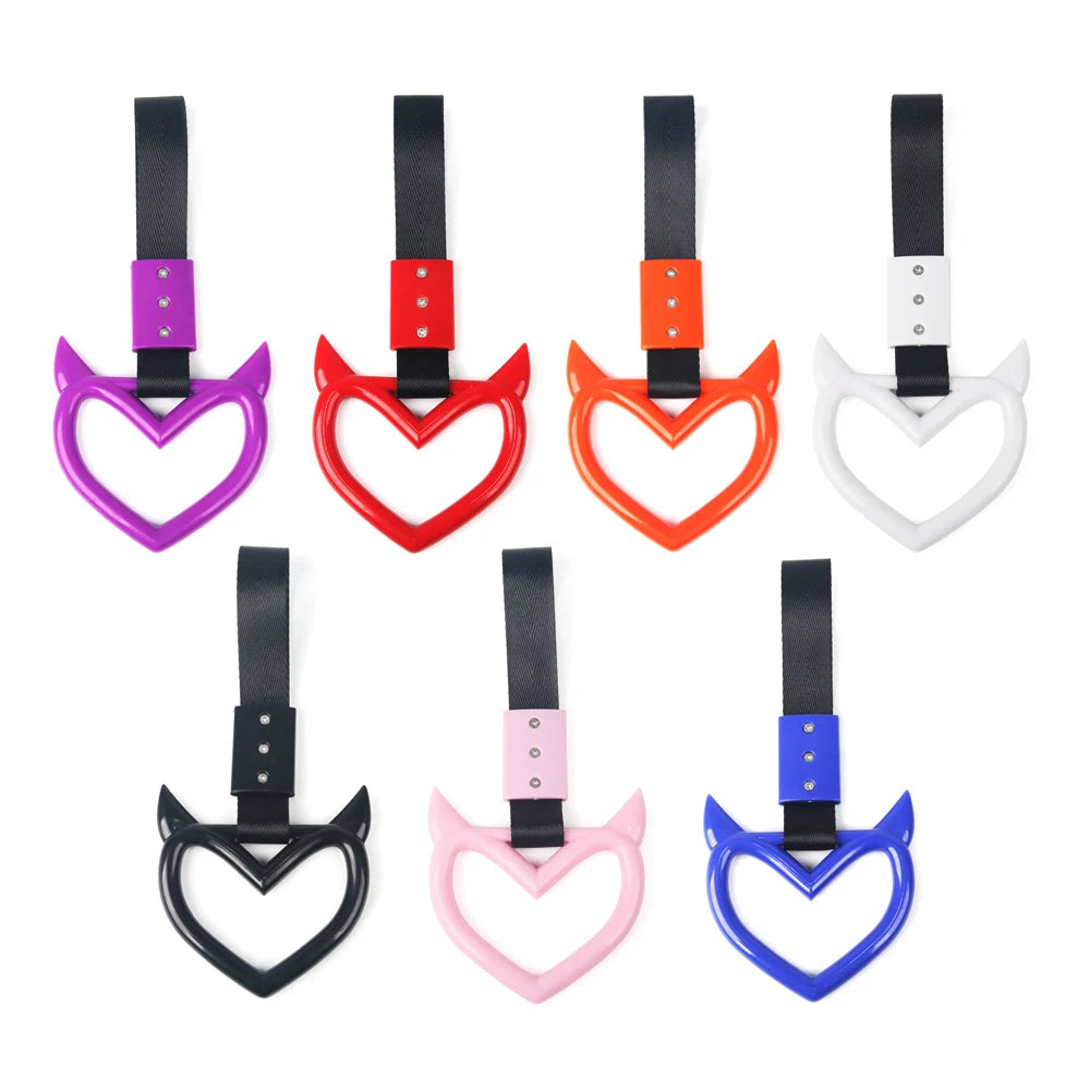 A collection of various colored car rear bumper warning straps and hand pull rings.