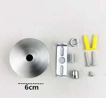 Modern stainless steel pendant lamp components including a disc, mounting plate, and various fasteners.