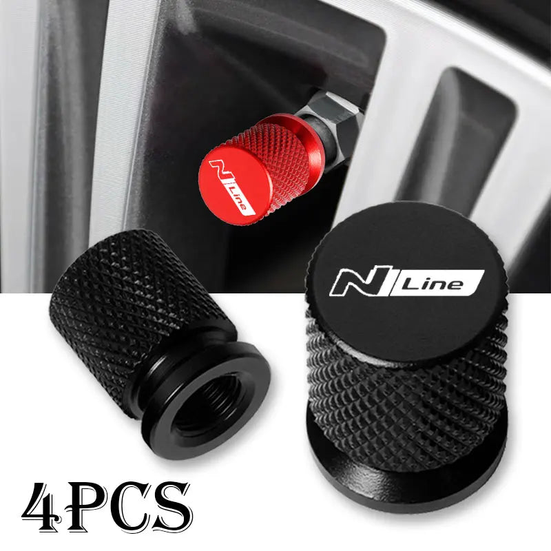 Set of four black aluminum tire valve caps with red accents for car wheels