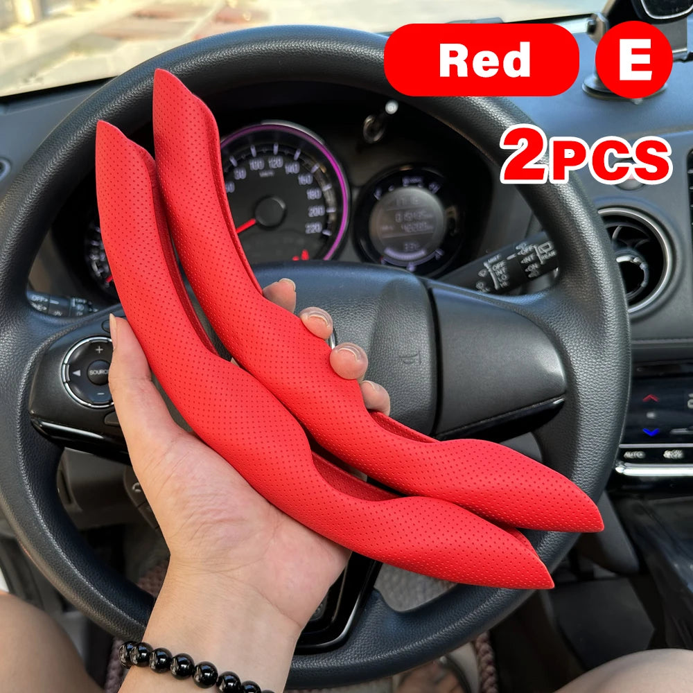Two red universal car steering wheel booster covers are shown being held in front of a black car steering wheel.