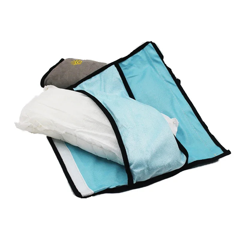 A blue car seat belt shoulder cushion with a white insert and gray fabric visible.