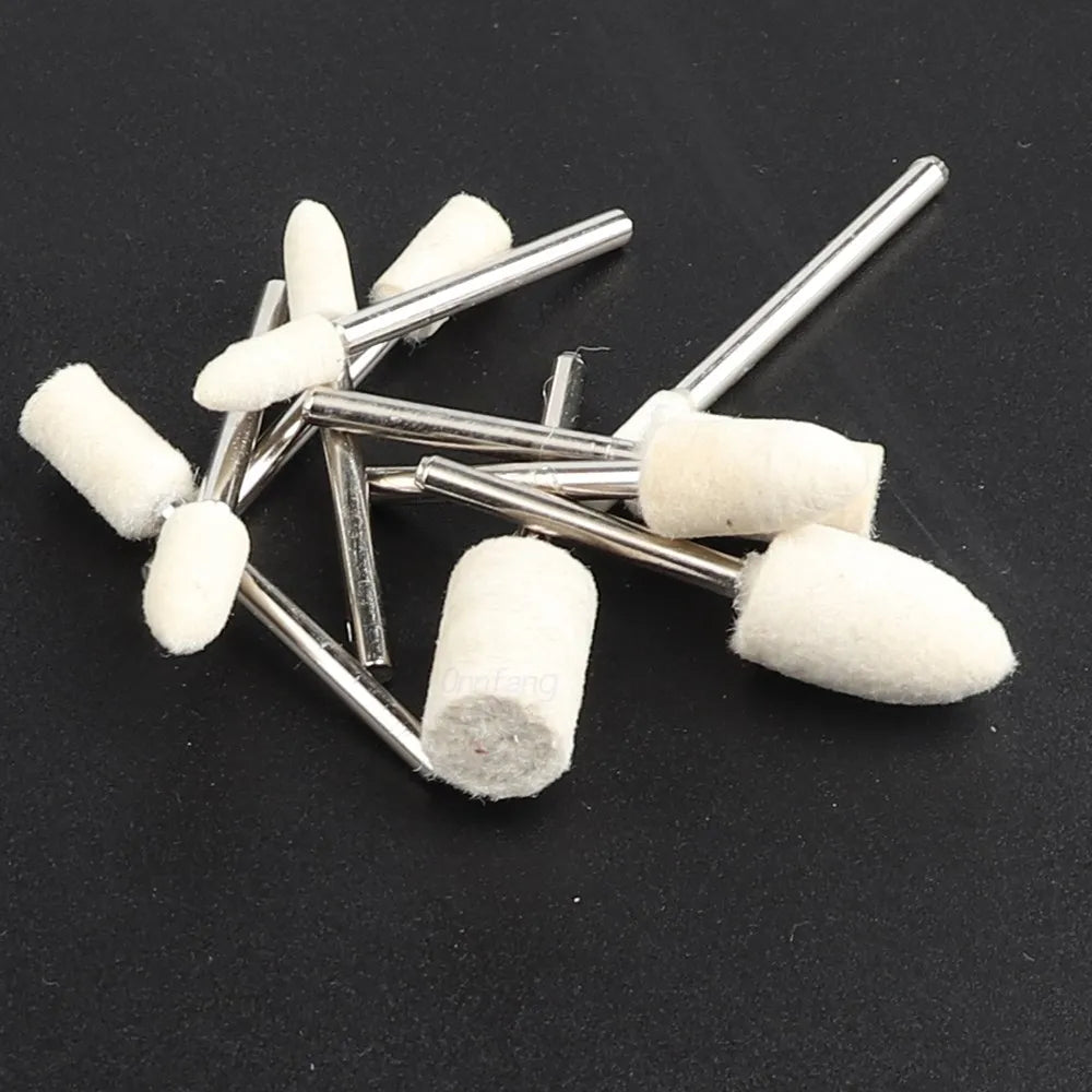 A collection of white wool felt polishing buffing wheels attached to metal rods.