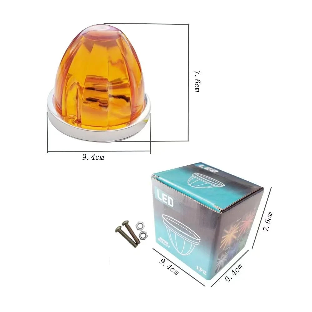 A clear amber universal DC side marker light with a plastic housing and mounting base.