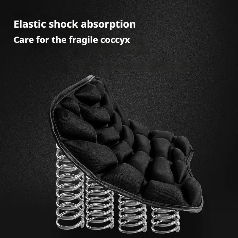 A black elastic shock absorption pad designed for care of the fragile coccyx, shown with coiled springs.