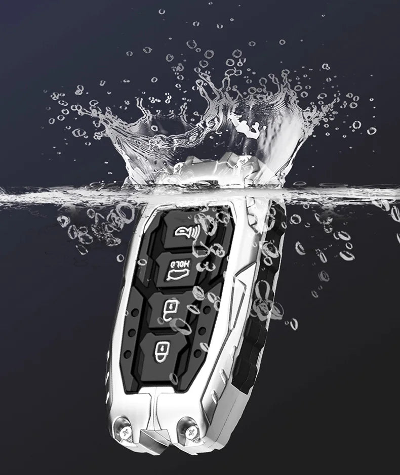 A silver car key fob cover is shown splashing water, highlighting its design and protective features.