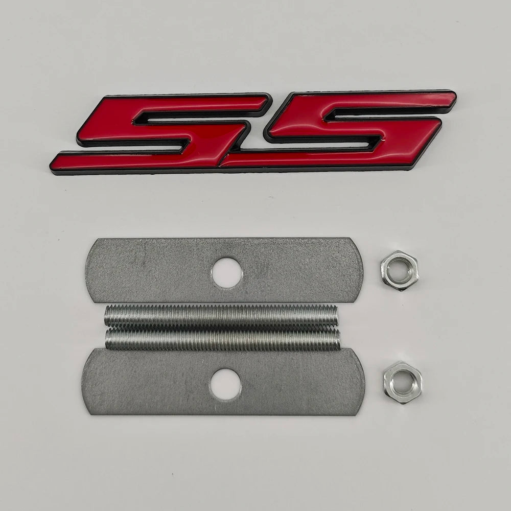 A silver metal emblem badge with a black and red SS design and mounting hardware.