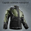A dark green and black waterproof motorcycle raincoat is shown, covered in water droplets.