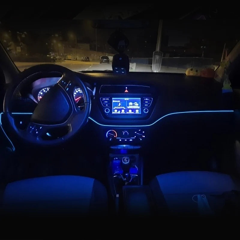 Interior view of a car dashboard showing ambient LED lighting and controls.