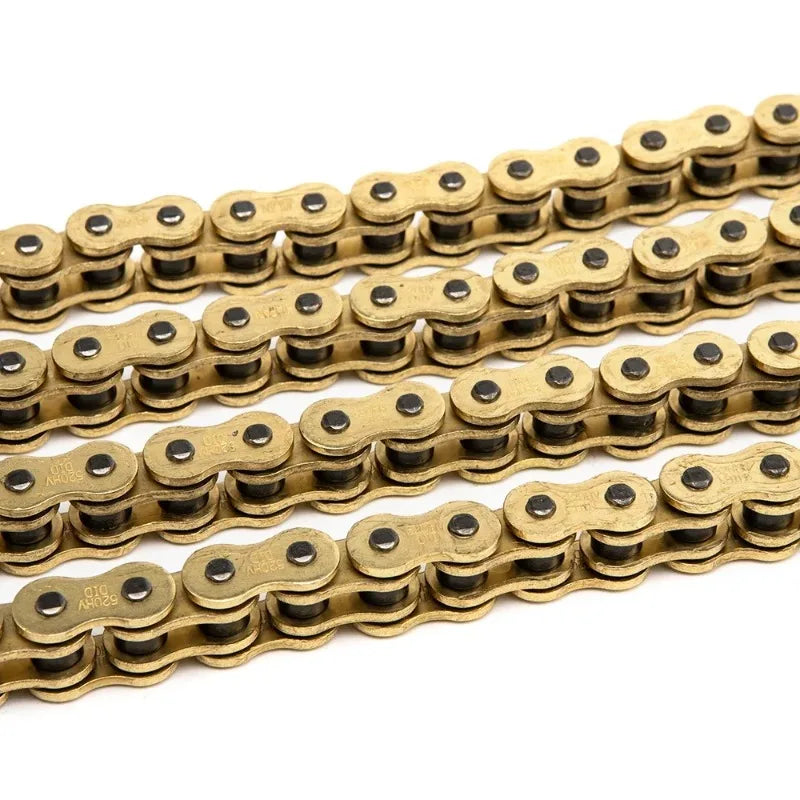 A close-up view of a heavy-duty motorcycle chain with interlocking oval links in a brass or gold color.