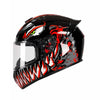 A black full face motorcycle helmet featuring a fierce red and white dragon design with glowing green eyes.