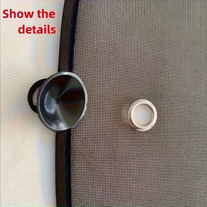 A close-up photo showing two metal sunshade components, including a circular disc and a ring, against a gray textured surface
