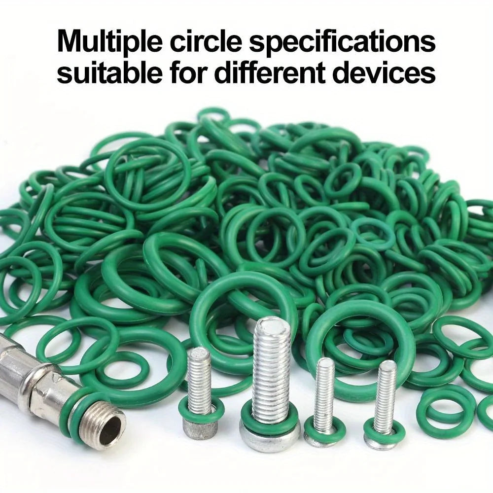 A pile of green rubber O-rings and various metal threaded components for different devices.