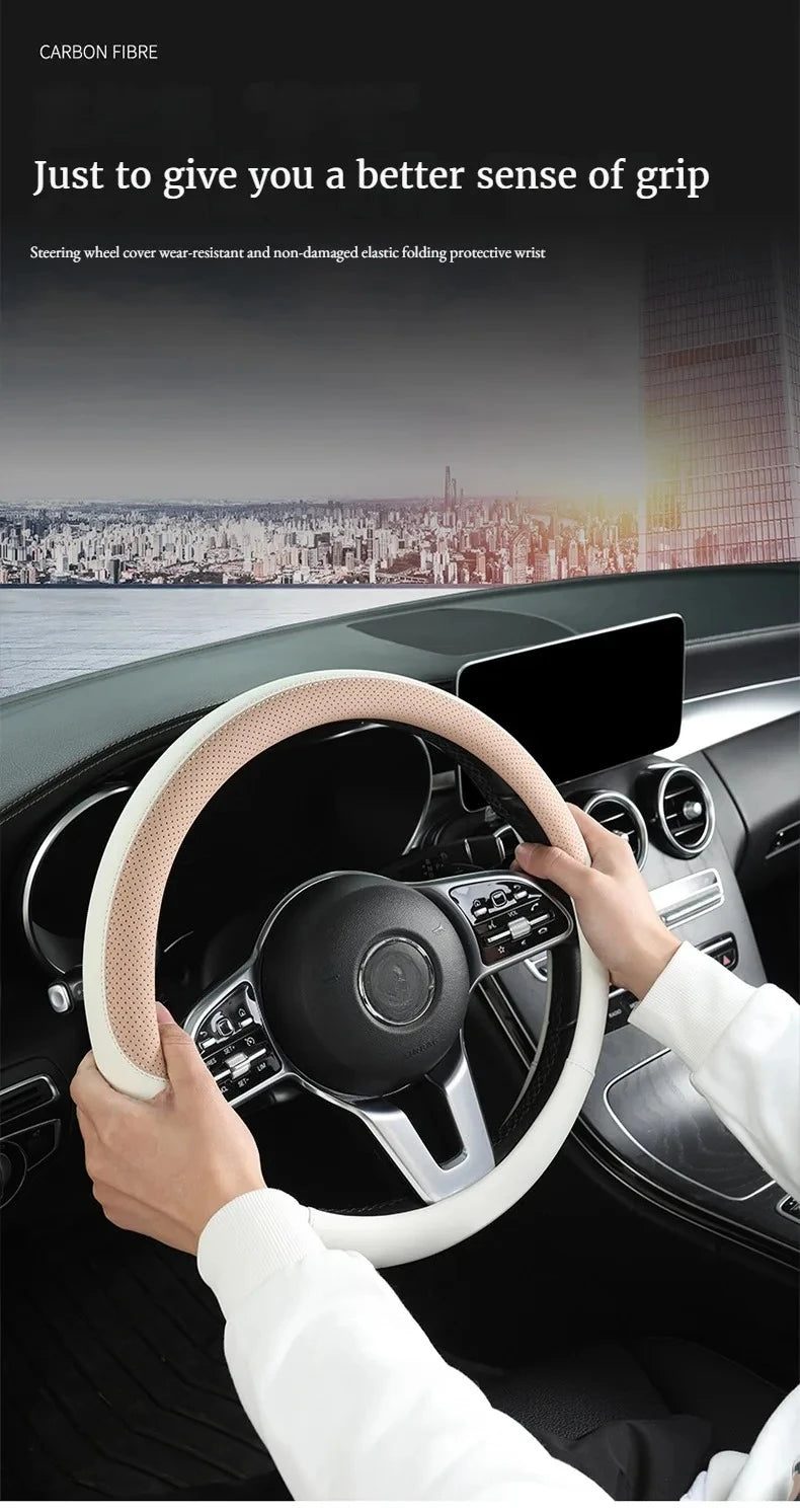 A hand is gripping a white perforated steering wheel cover on a car's steering wheel.
