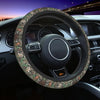 Steering wheel covered in camouflage patterned material inside a car