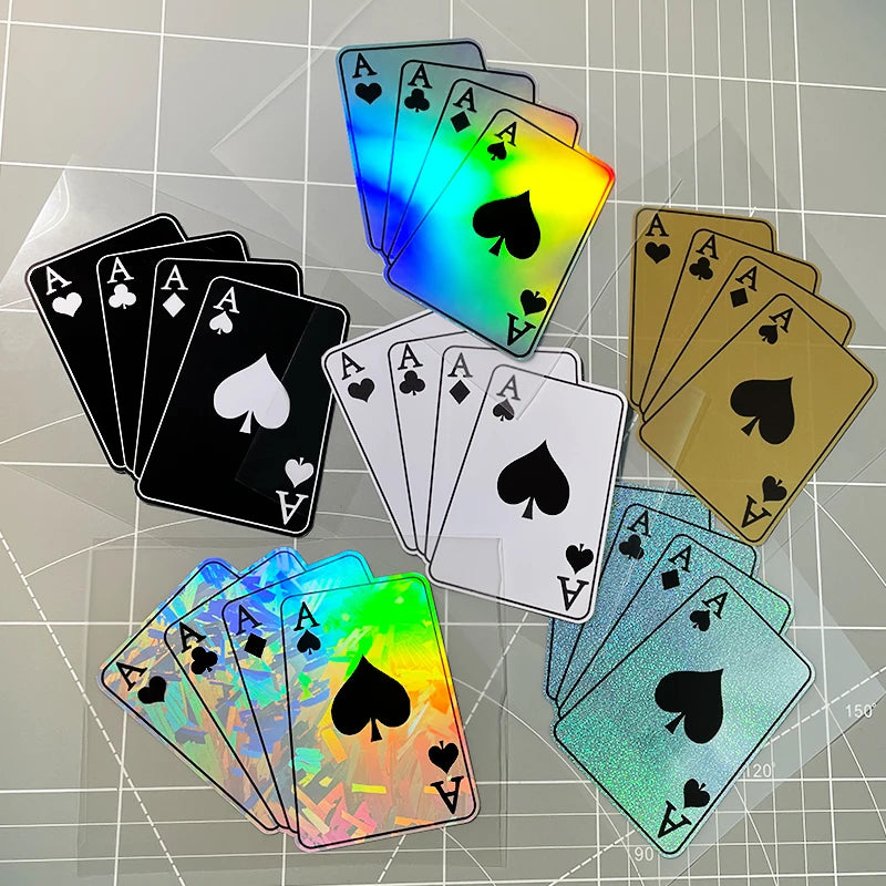 A collection of colorful playing cards, including aces and hearts, arranged on a transparent surface.