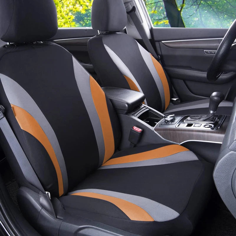 Front passenger car seat covered in black and orange breathable fabric covers