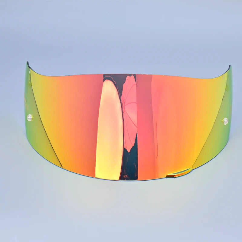 A curved, tinted visor shield for a motorcycle helmet, featuring an orange-to-green gradient and a central vertical stripe.