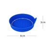 A bright blue silicone cup holder coaster with a textured surface and a rim of small rhinestones.