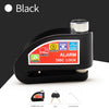 Black alarm disc lock with a push down mechanism and key for motorcycle or bicycle security