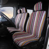 A close-up view of a van interior showing a striped universal seat cover set on the driver's seat.
