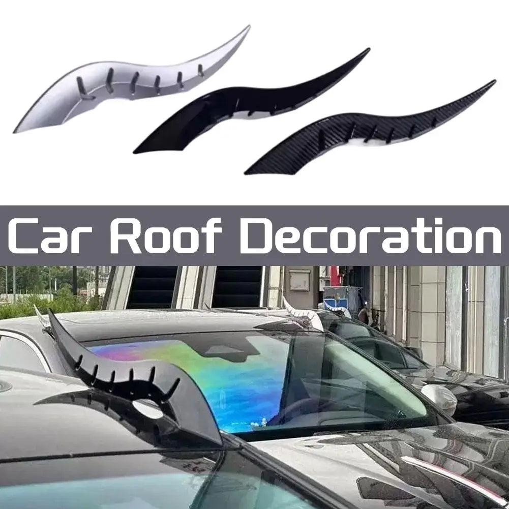 Black and silver dragon horn roof decorations displayed on a car.