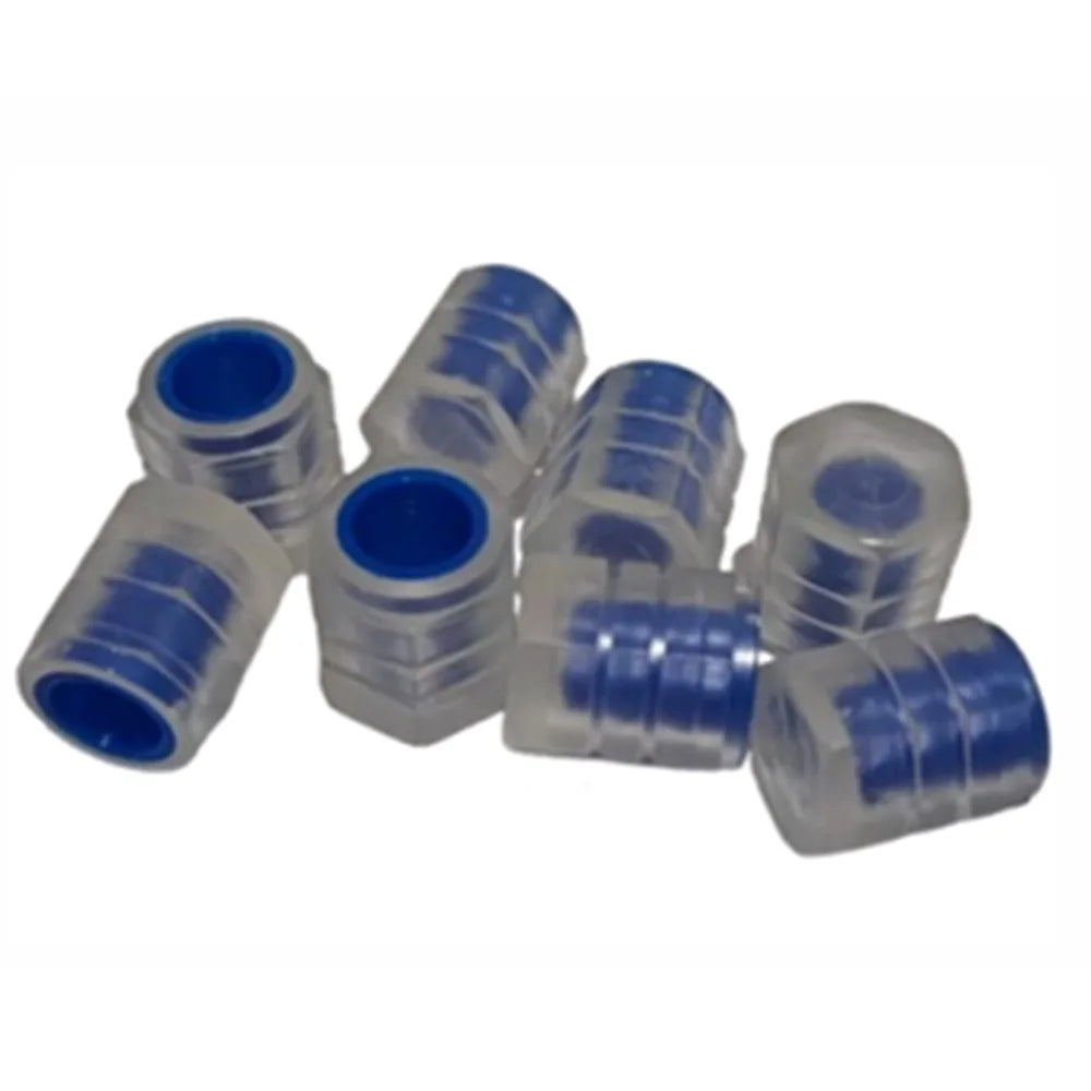 A collection of clear and blue self-luminous tire valve caps.