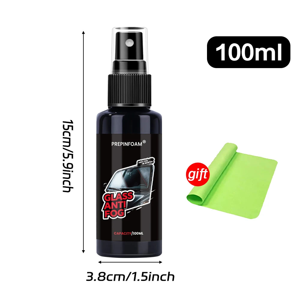 A black glass spray bottle with a green cap and a lime green anti-fog solution, labeled for clear windshield vision.