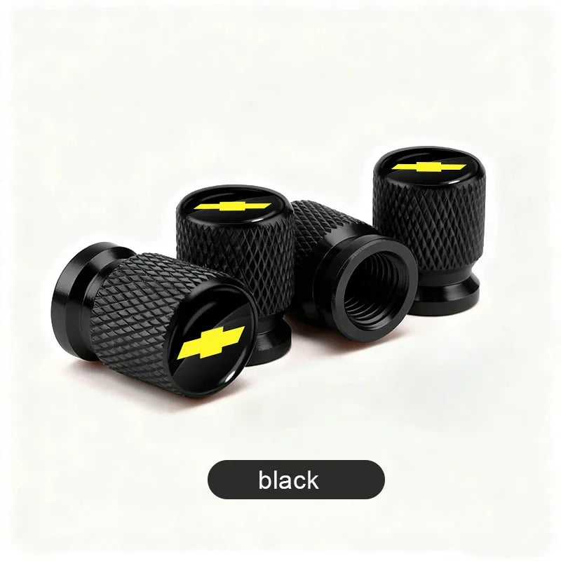 Black durable aluminum tire valve covers shown in various sizes and angles.