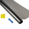 A close-up view of a rolled, reflective car window tint film and a yellow tool.