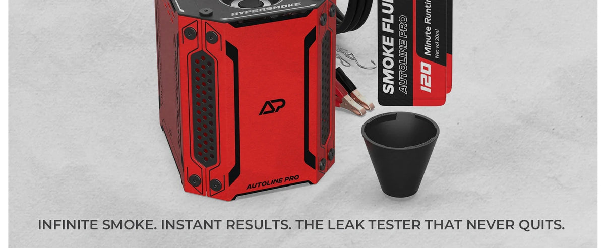 A red smoke machine and a black leak tester are shown on a light gray surface.