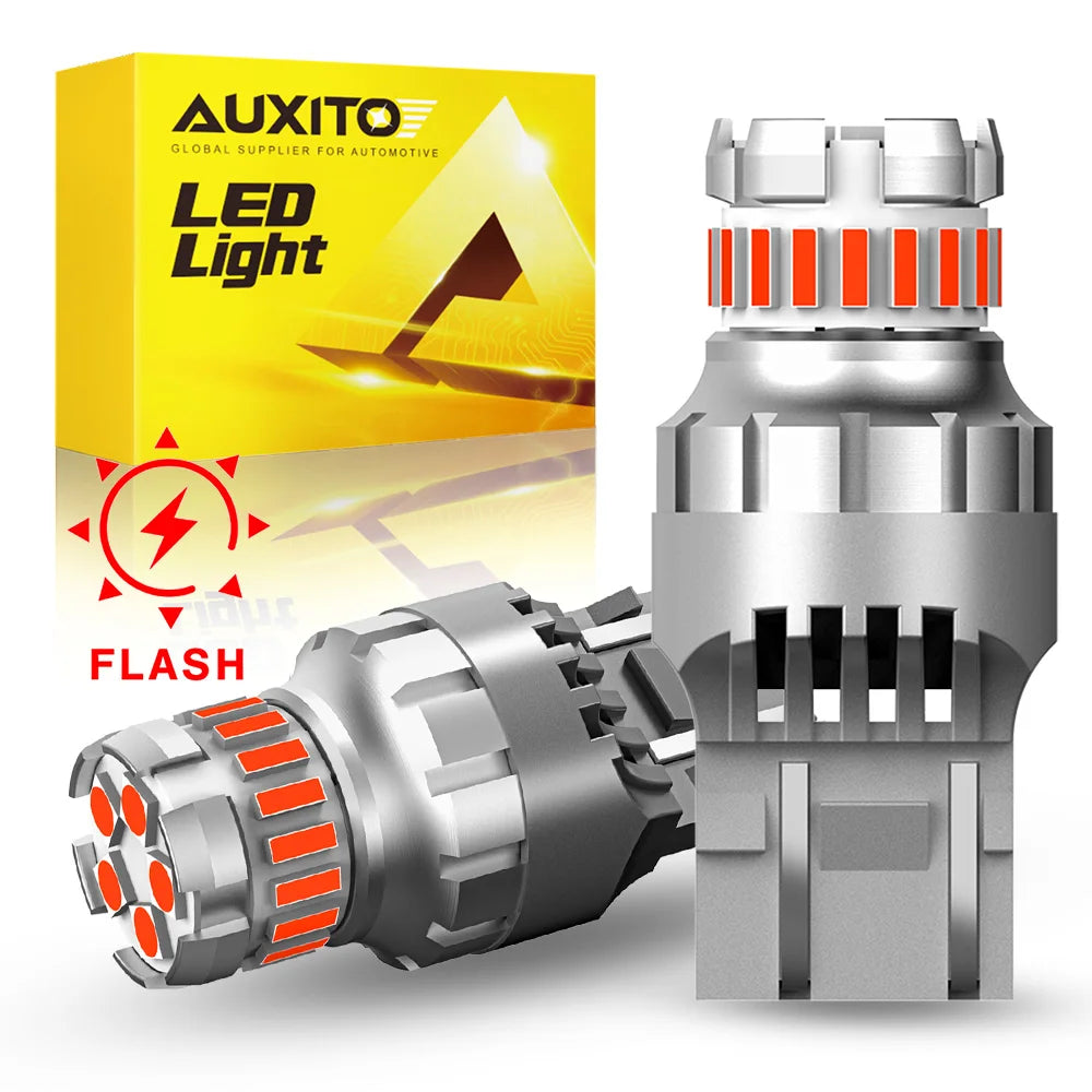 A package of AUXITO LED Light flash bulbs and a silver strobe brake light bulb with dual socket compatibility.