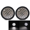 A pair of round LED trailer tail lights with brake and turn signal lenses.