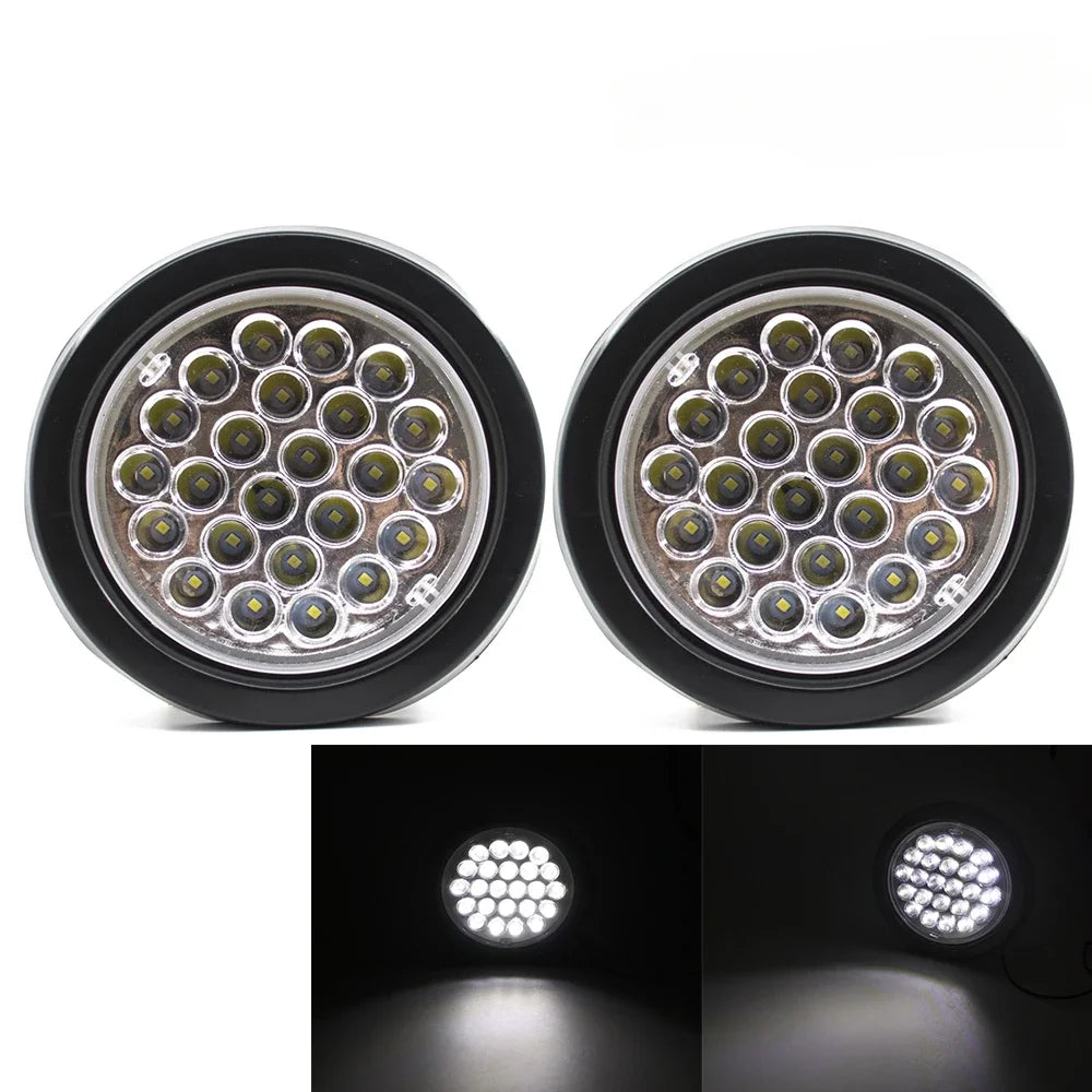 A pair of round LED trailer tail lights with brake and turn signal lenses.