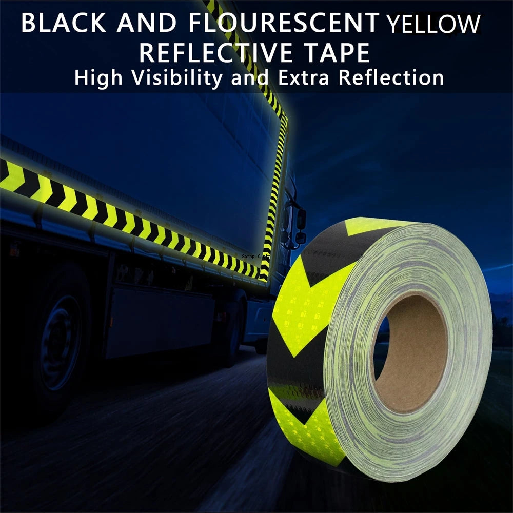 Roll of black and fluorescent yellow reflective tape used for high visibility on a truck