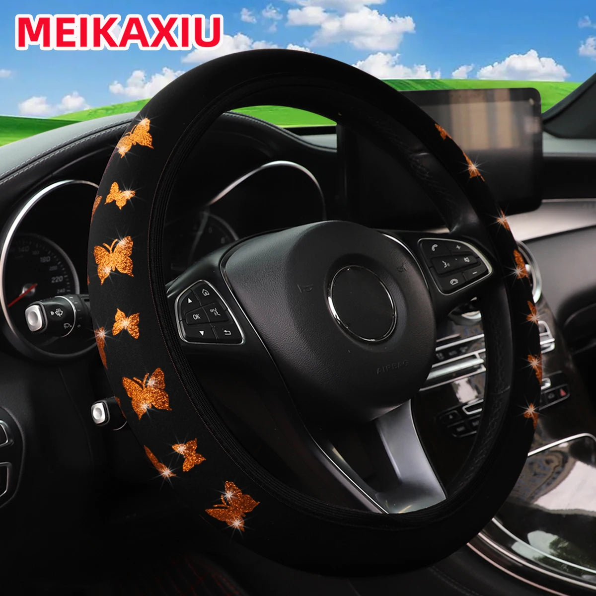 Black steering wheel cover decorated with glitter orange butterflies for a car interior