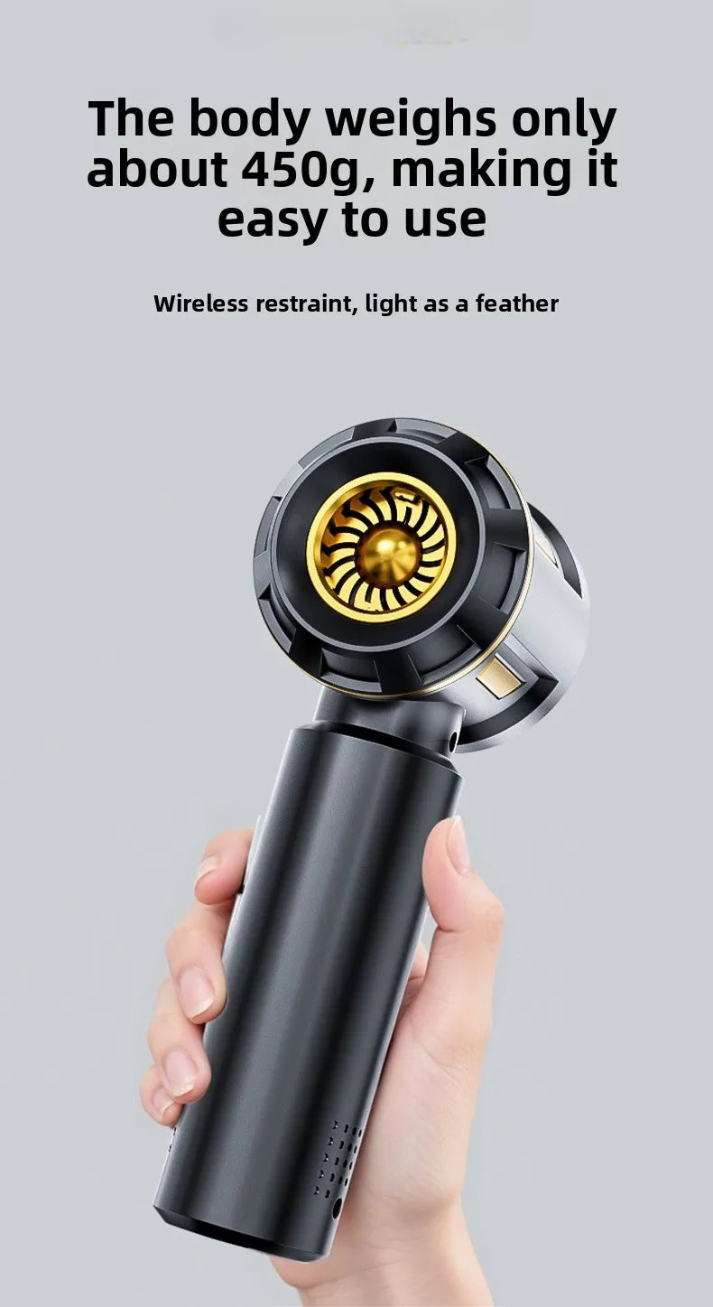 A hand holds a black cordless handheld vacuum cleaner with a gold nozzle, demonstrating its light weight.