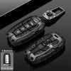 A black universal car key fob cover for Hyundai and Kia models shown with a close-up of the four buttons.
