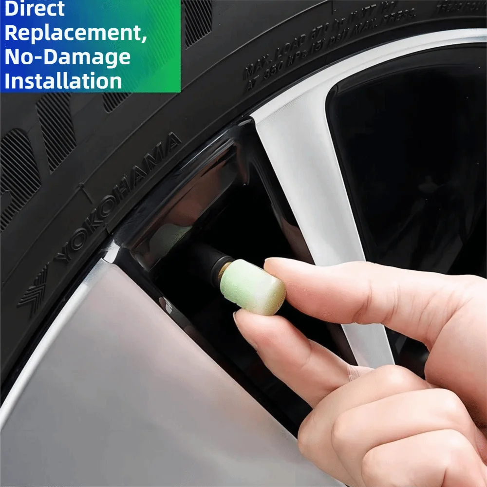 A hand is installing a self-luminous tire valve cap into a wheel rim of a car tire.