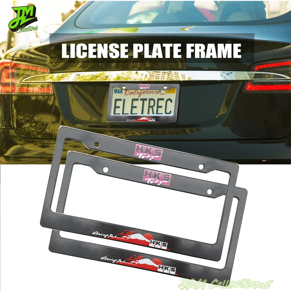 A black license plate frame decoration with an HKS logo is shown in front of a dark car.