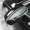 Close-up of a black car rearview mirror with a clear, textured visor installed.